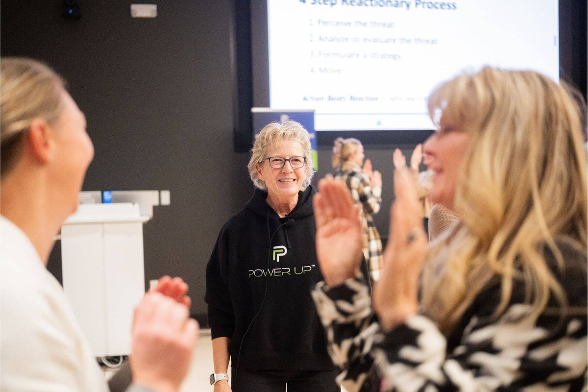 Lisa Davis overseeing participants during a corporate self-defense workshop