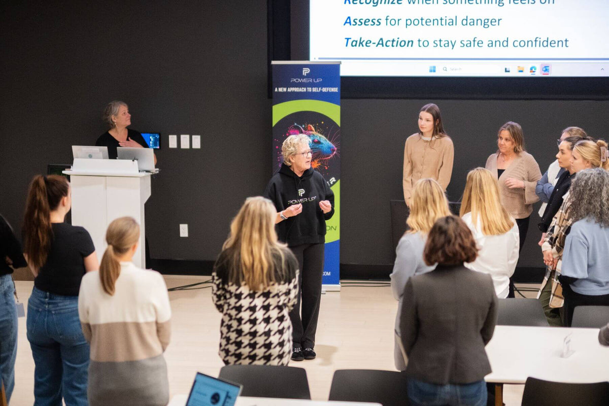 Lisa Davis presenting to a group of employees at a Power Up with Lisa corporate event