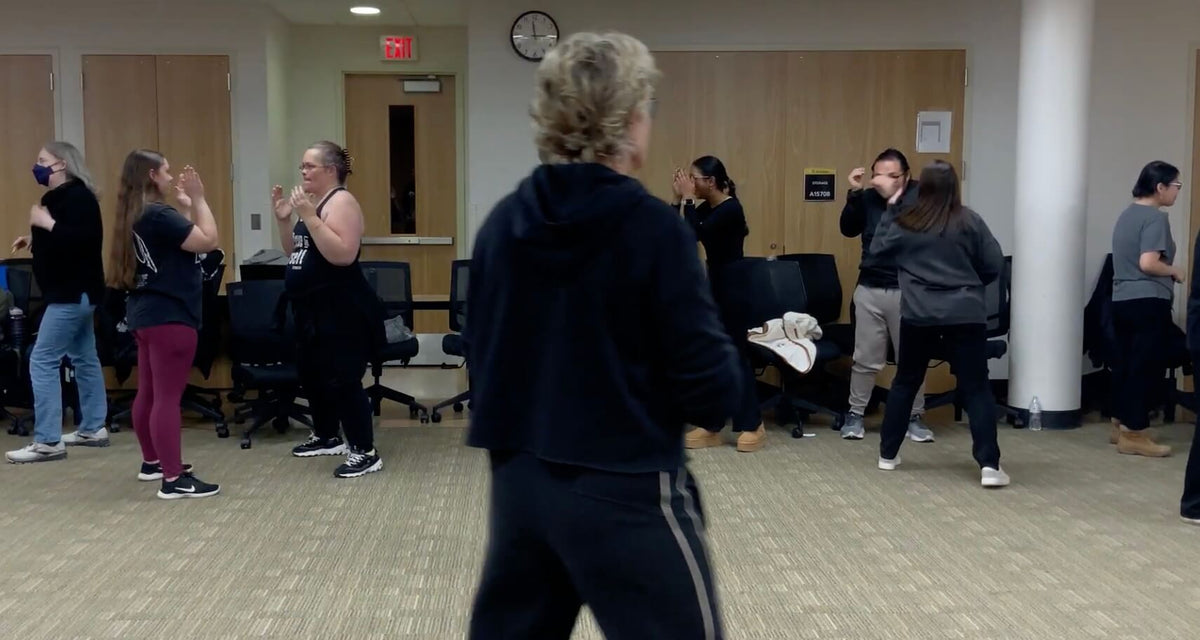Lisa Davis watching college students practice a ready stance