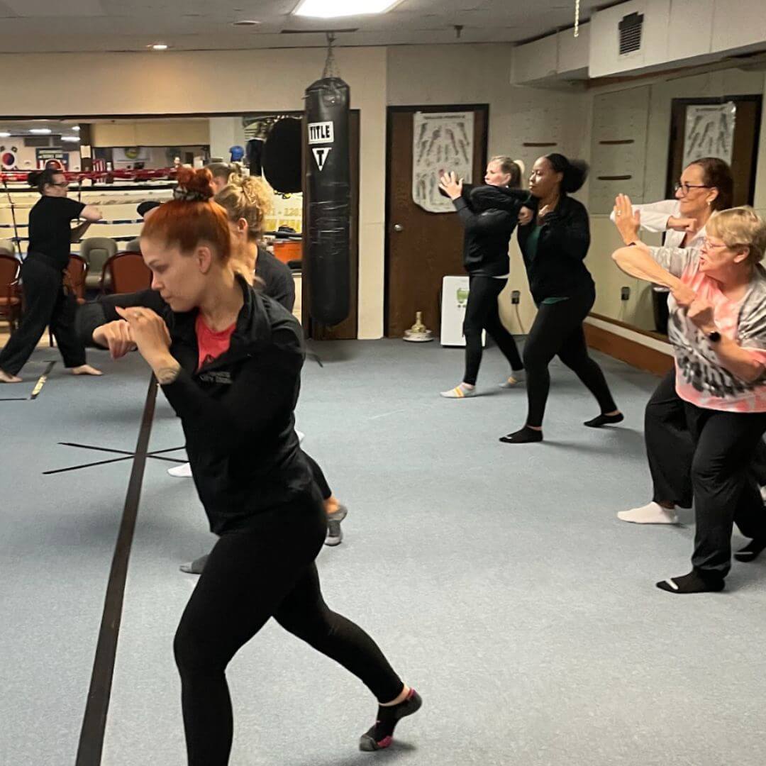 Students practicing self-defense moves at a Power Up with Lisa in-person class